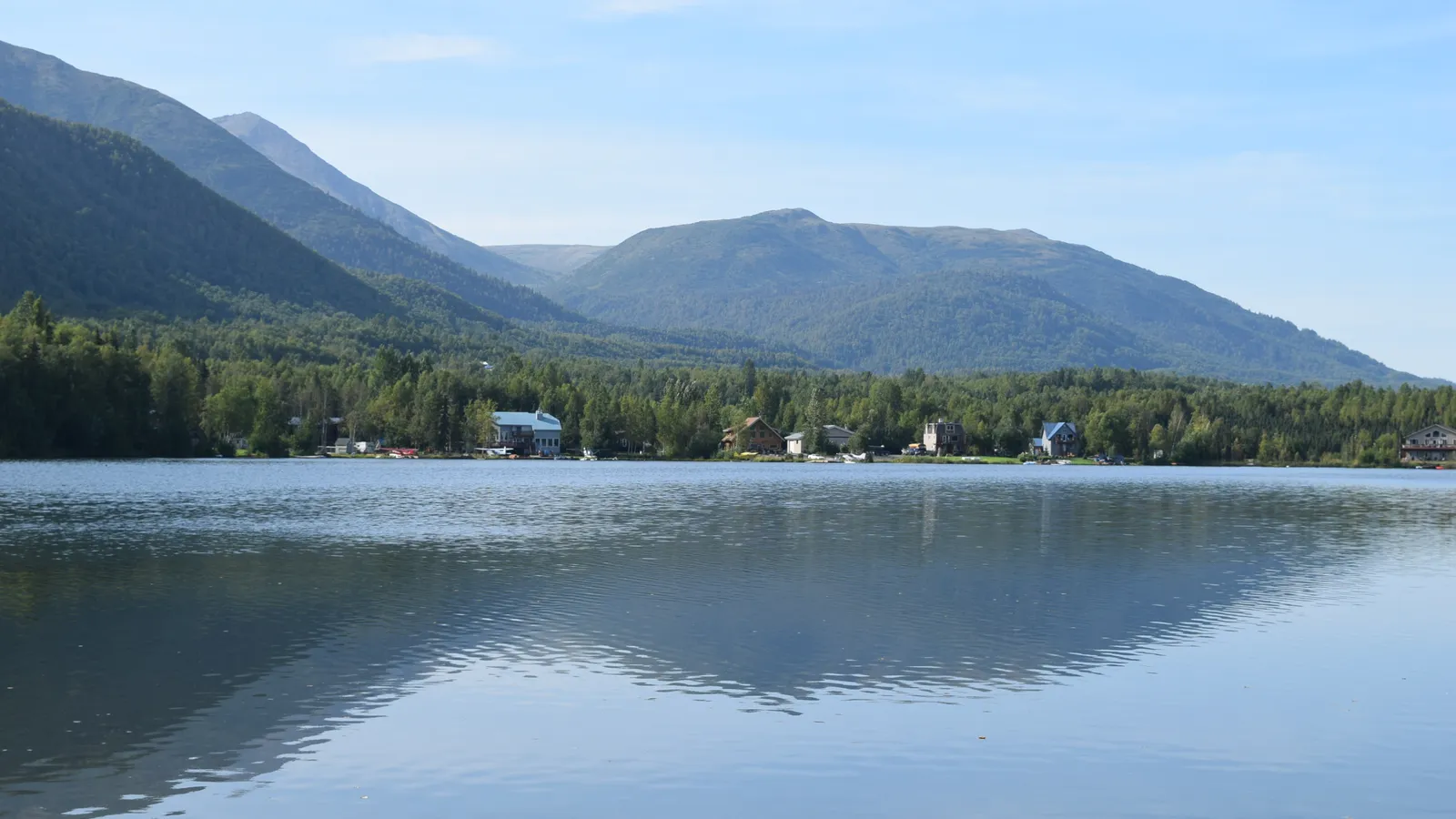 Mirror Lake reflecting the Chugach Mountains beside the Glenn Highway in Chugiak
