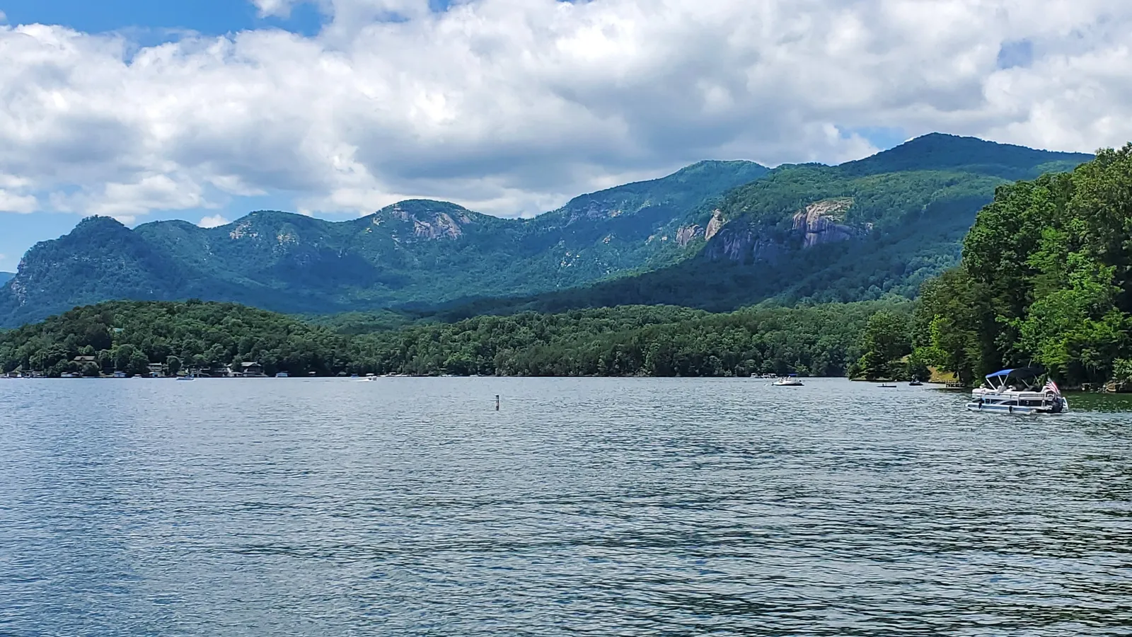 Lake Lure with the cliffs of Chimney Rock and the Blue Ridge behind