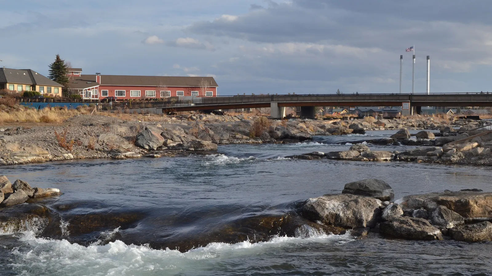 Rocky rapids in the passageway channel of the Bend Whitewater Park, below the Colorado Avenue bridge