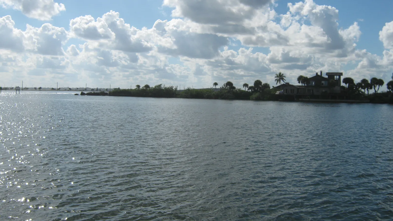 Open water on the Banana River lagoon under puffy clouds