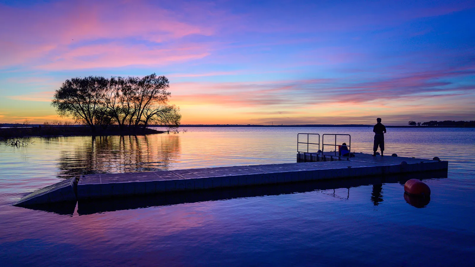 A floating dock on Grapevine Lake at sunset