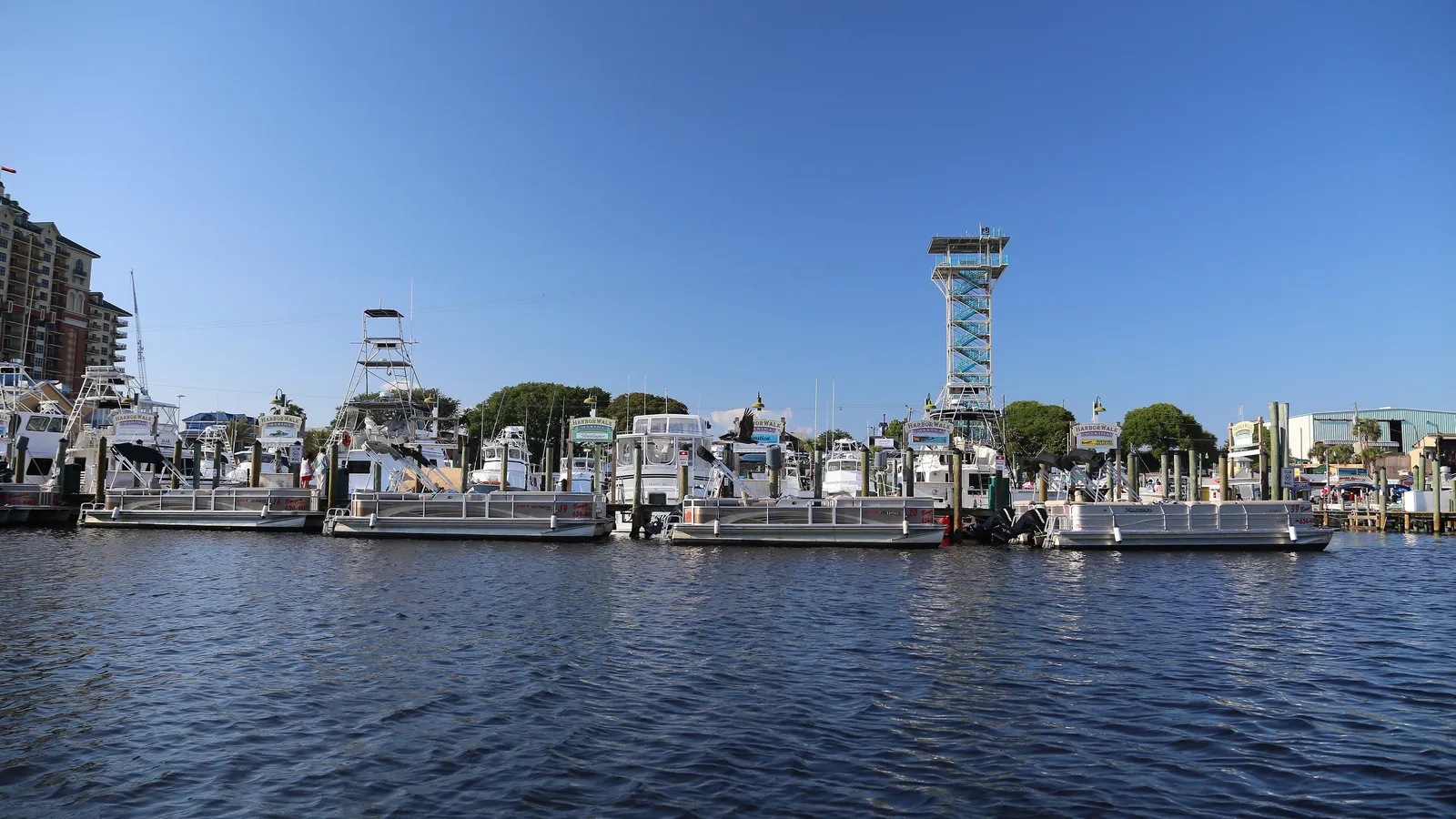 Charter boats and the HarborWalk Village tower on Destin Harbor