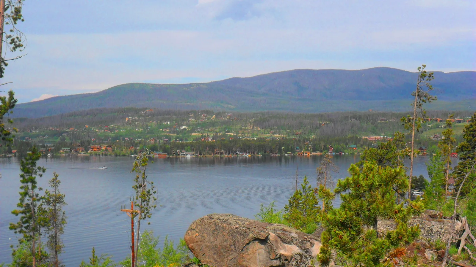Shadow Mountain Lake below forested hills near Grand Lake