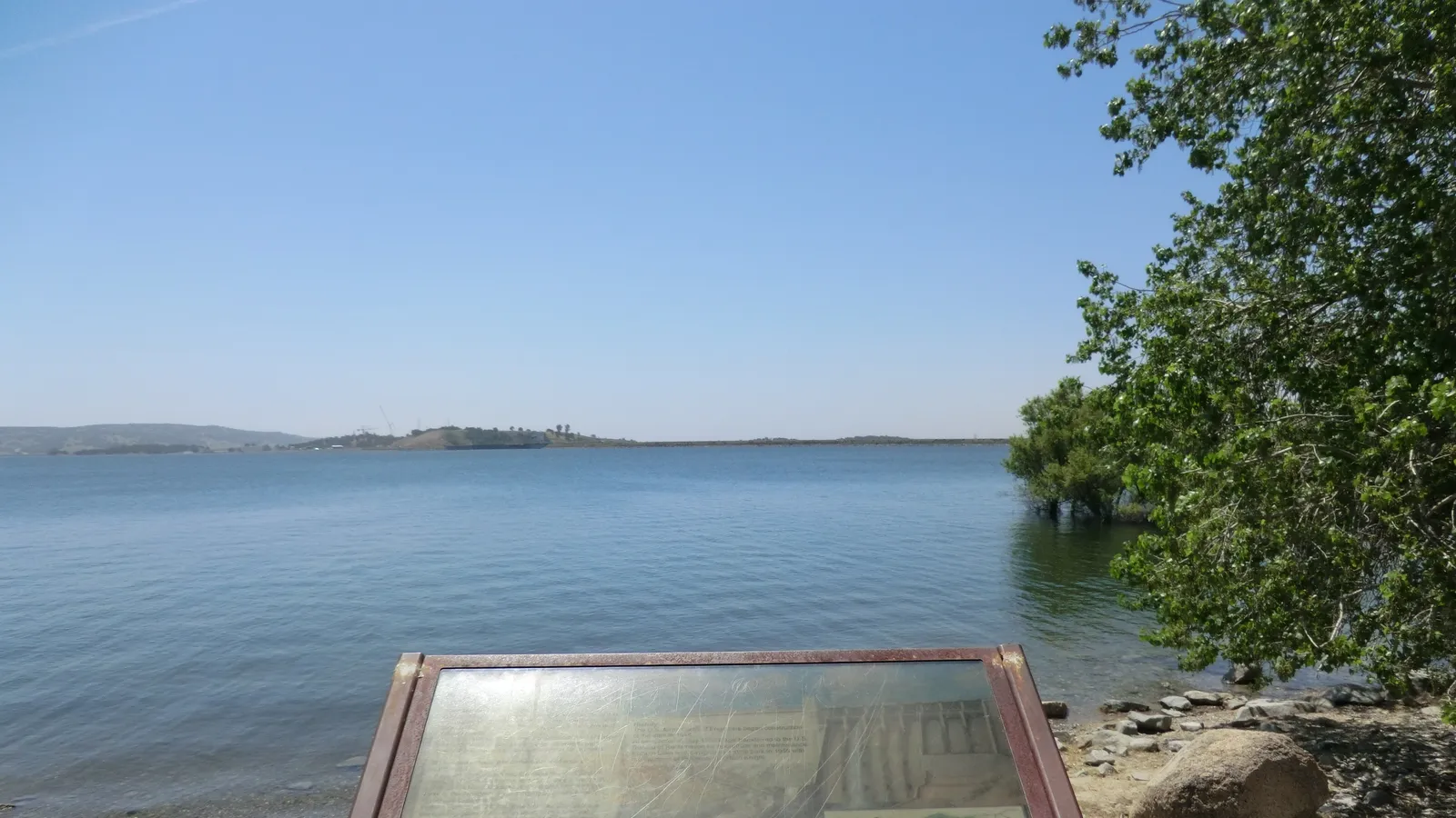 Calm open water on Folsom Lake seen from the shore at Beals Point