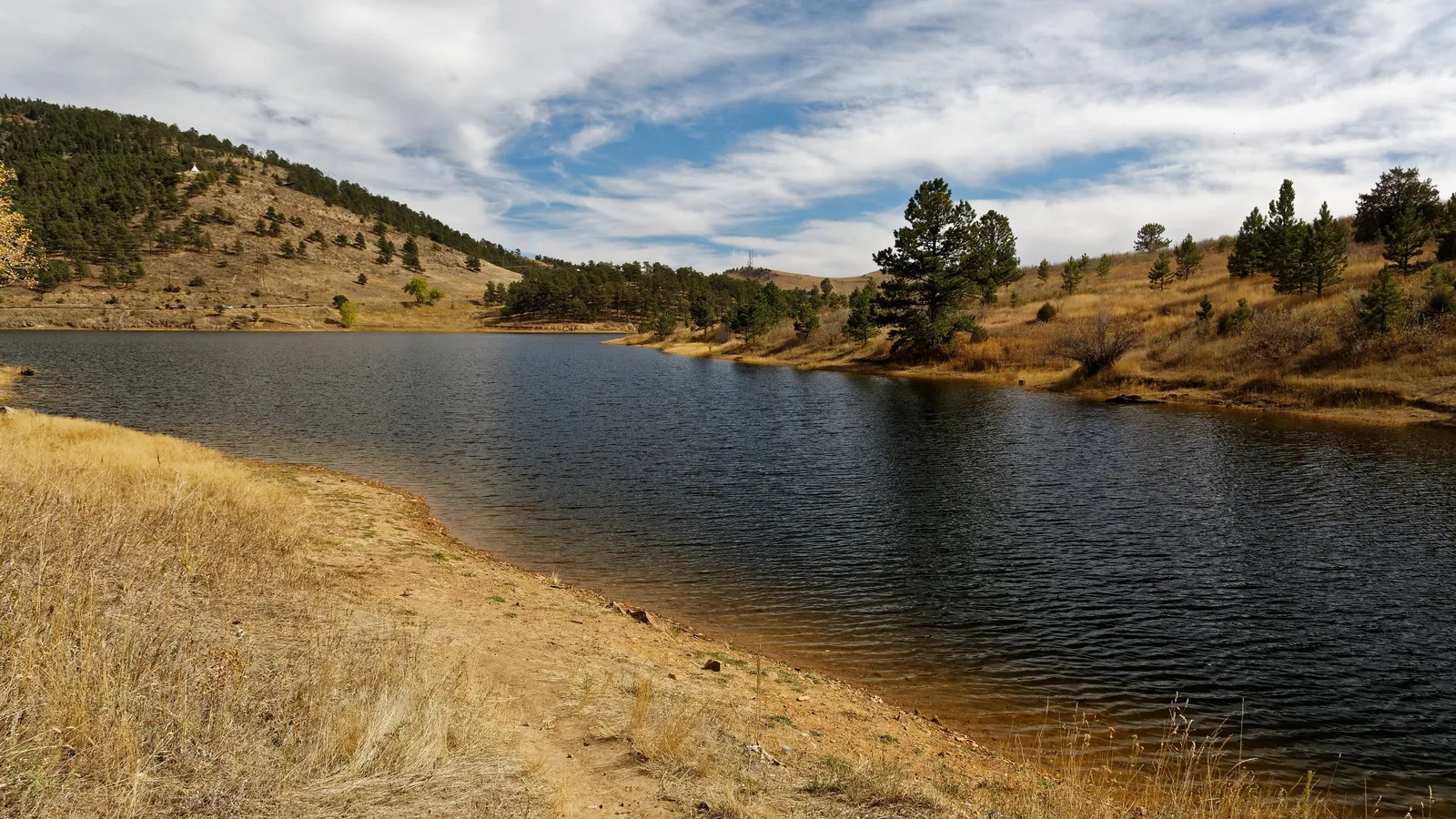 Pinewood Reservoir below pine-covered hills west of Carter Lake