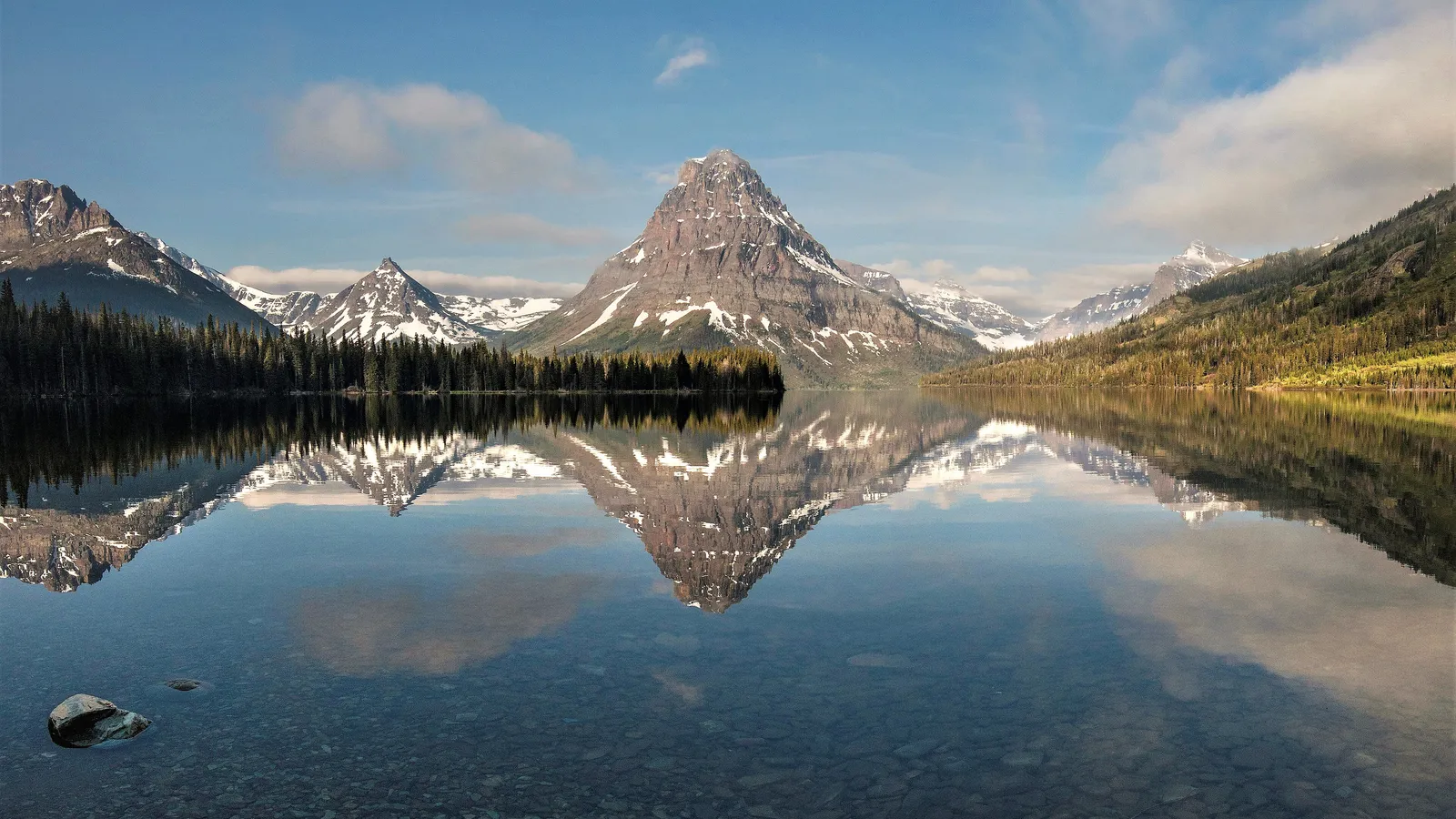 Sinopah Mountain reflected in calm Two Medicine Lake