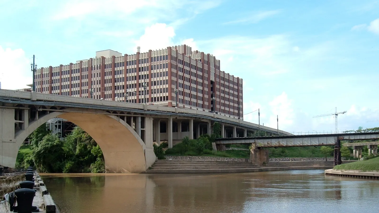 Buffalo Bayou at Allen's Landing in downtown Houston, with bridges and the One Main Building behind