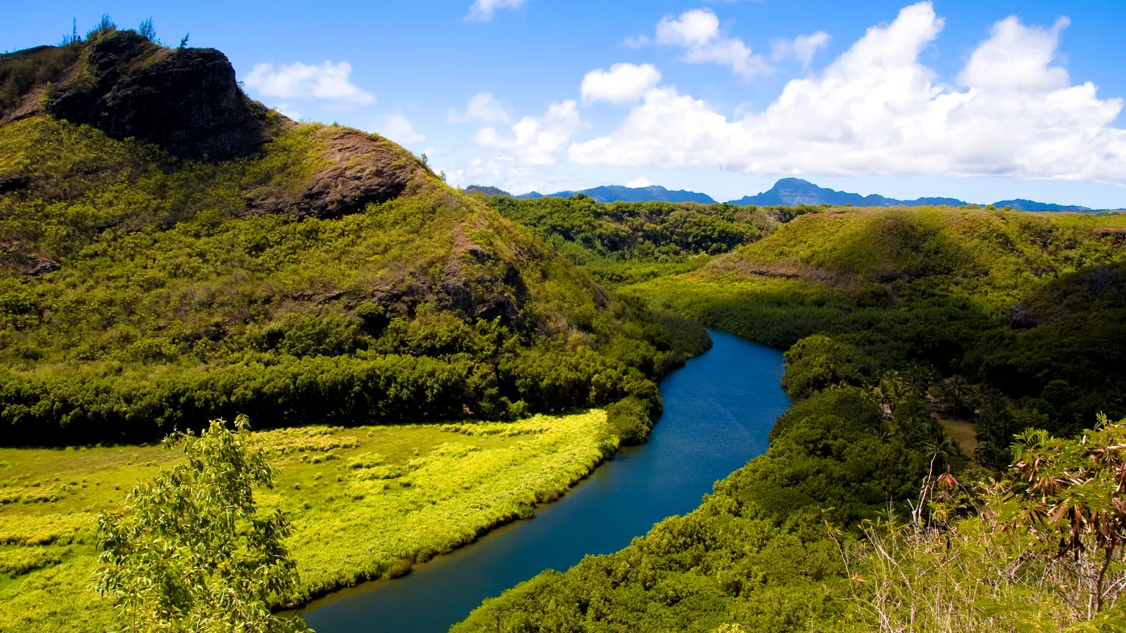 The Wailua River curving through green hills in Wailua River State Park