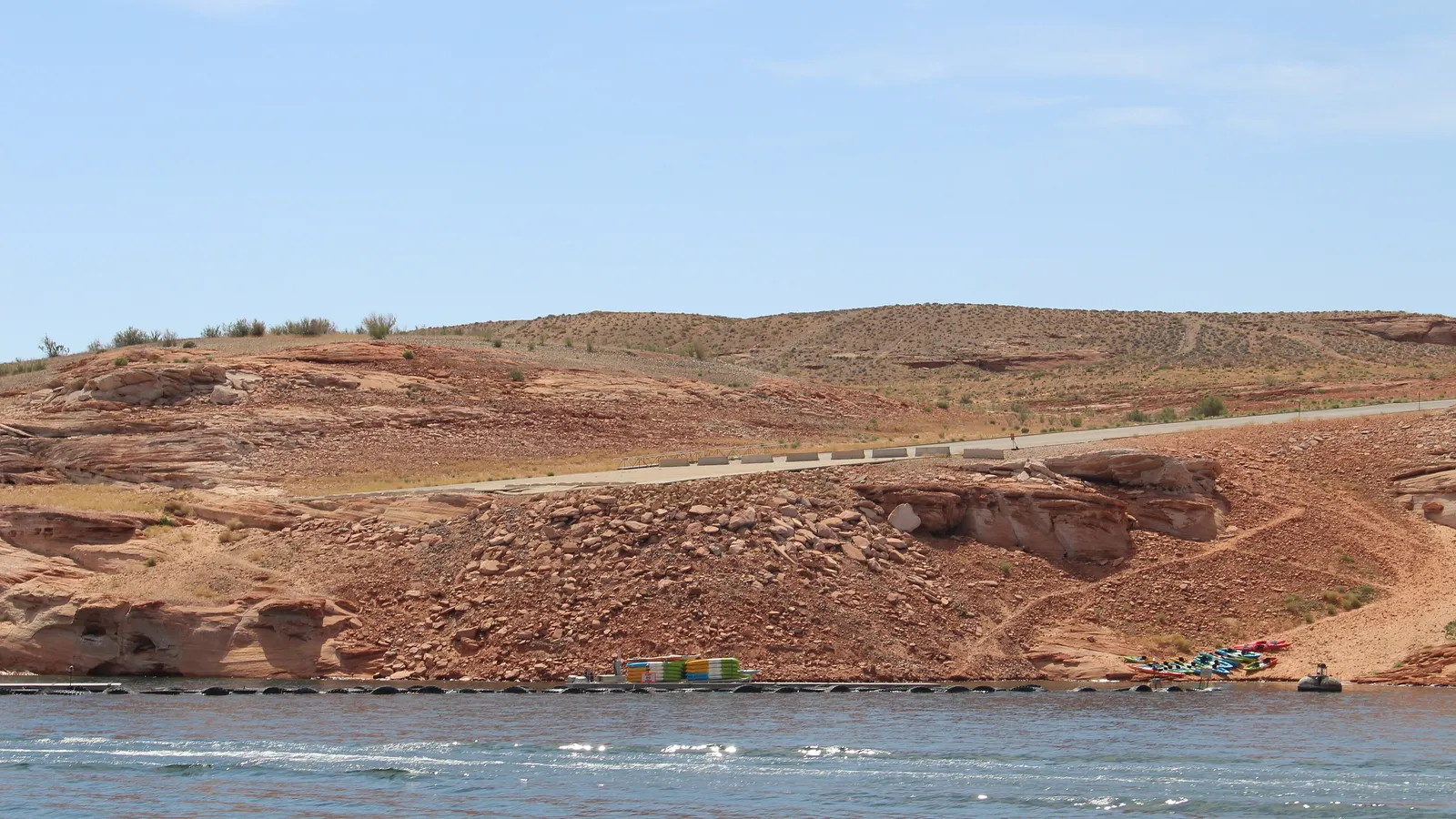 The Antelope Point public launch area on Lake Powell, with a road leading down red rock to the water