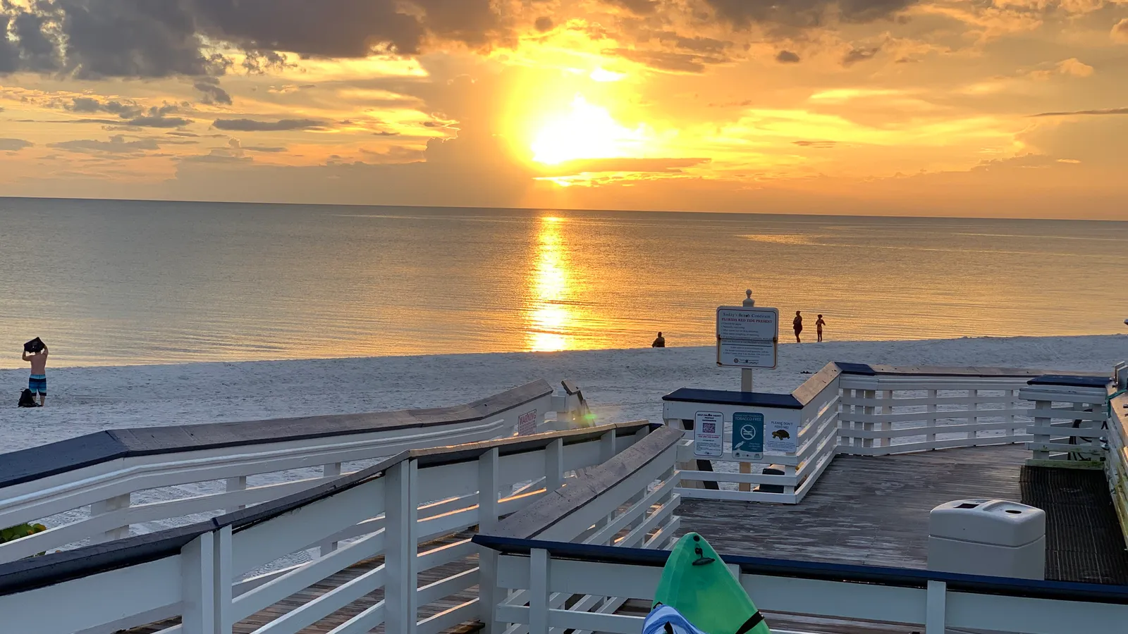 Sunset over the Gulf from the beach deck at Clam Pass Park