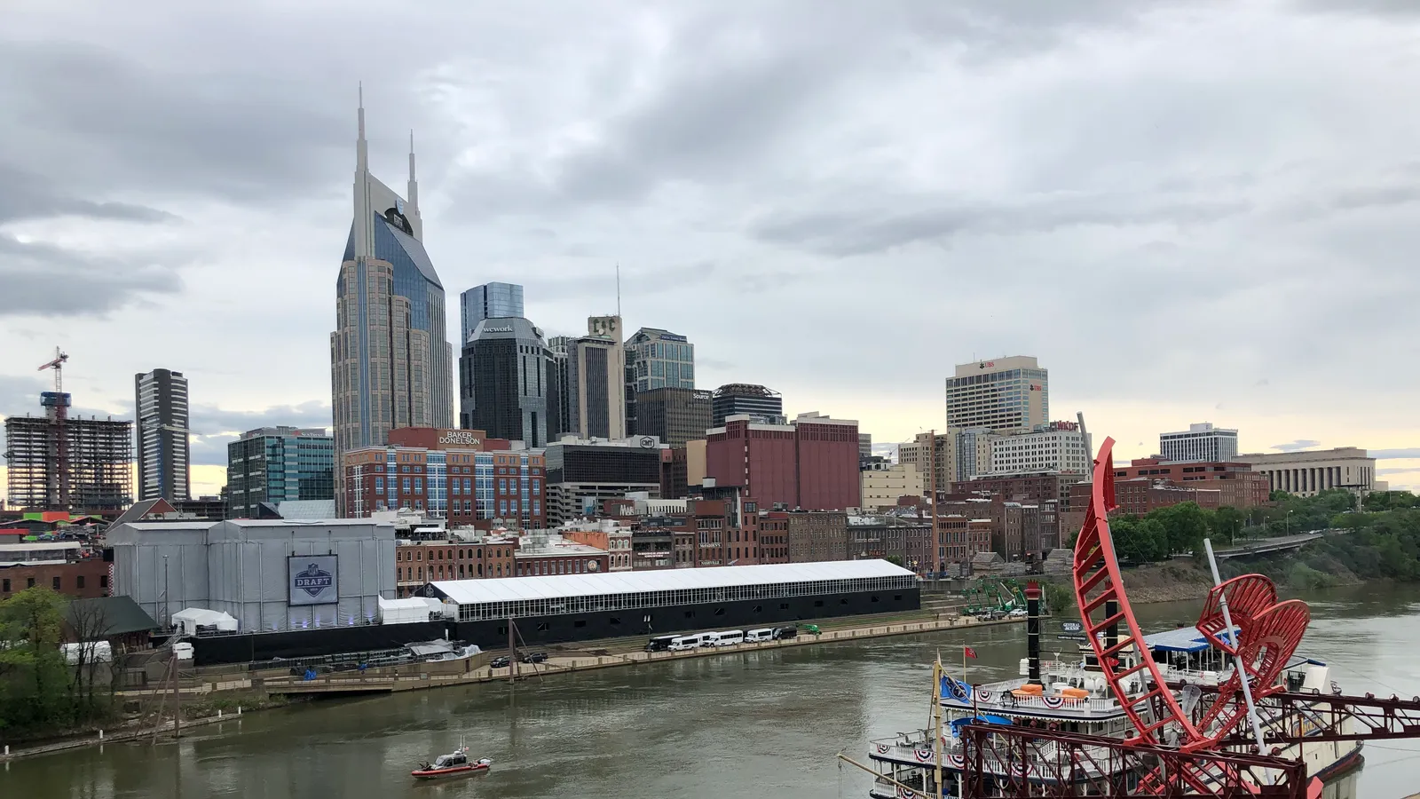 The Cumberland River below the downtown Nashville skyline, with a riverboat docked at the bank
