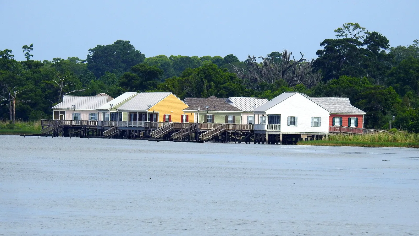 Colorful cabins on stilts over Lake Pontchartrain at Fontainebleau State Park