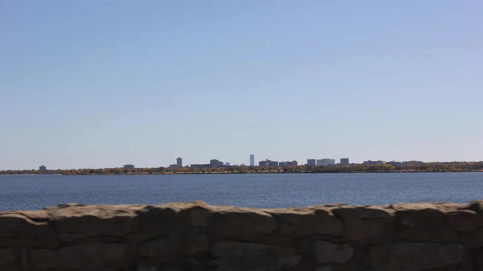 Open water on Lake Hefner with the Oklahoma City skyline on the horizon