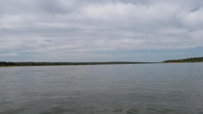 Wide, calm water on Lake Thunderbird under a cloudy sky
