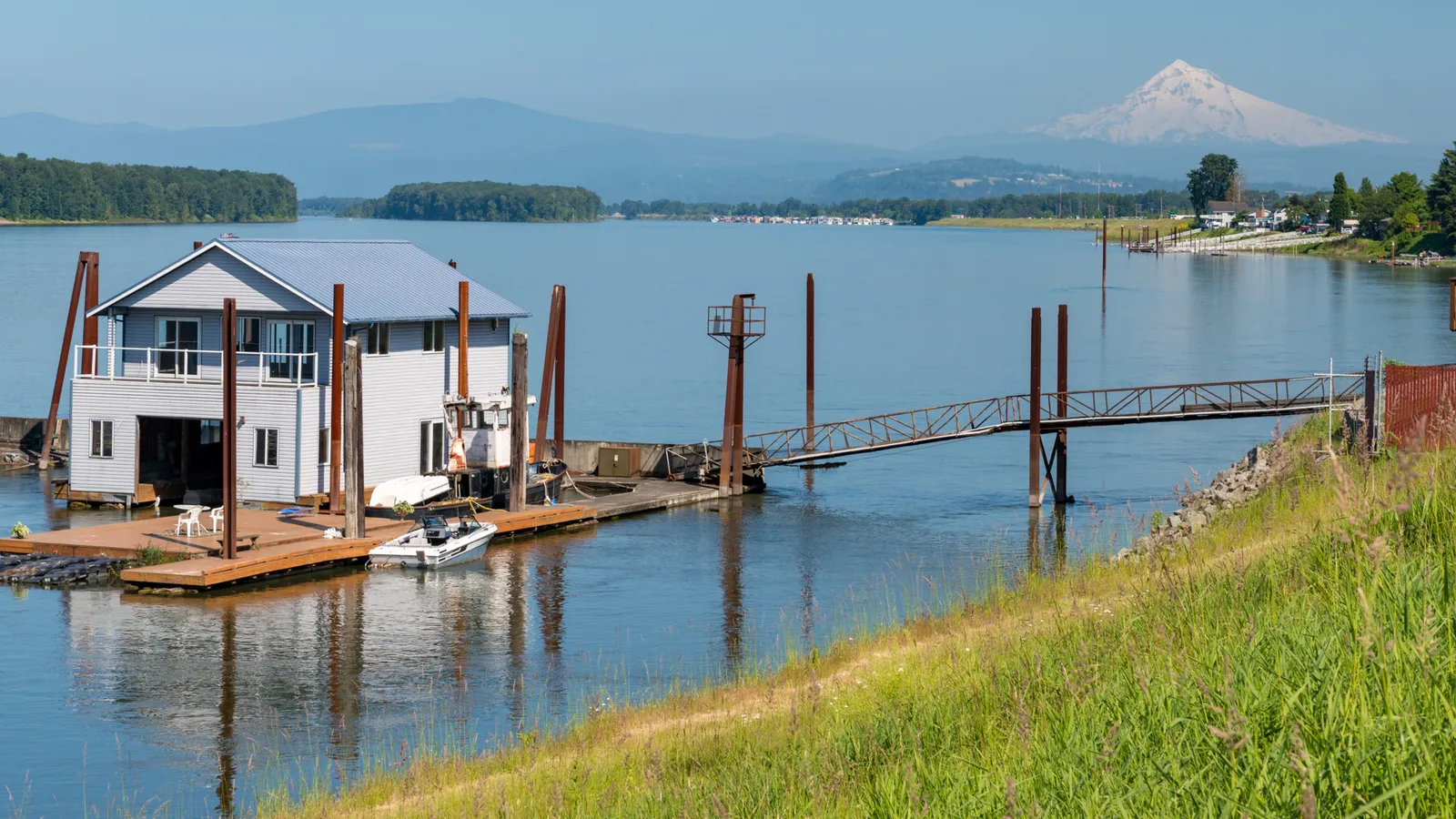 Floating homes on the Columbia River off Marine Drive, with Mount Hood in the distance
