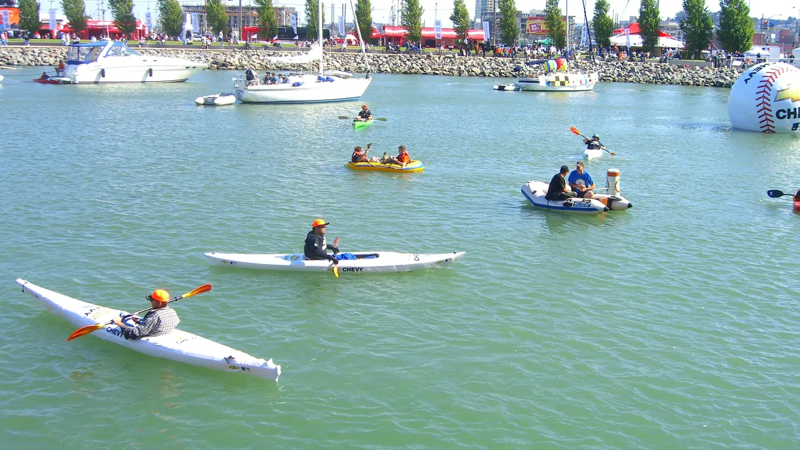 Kayakers and small boats in McCovey Cove beside the Giants' ballpark
