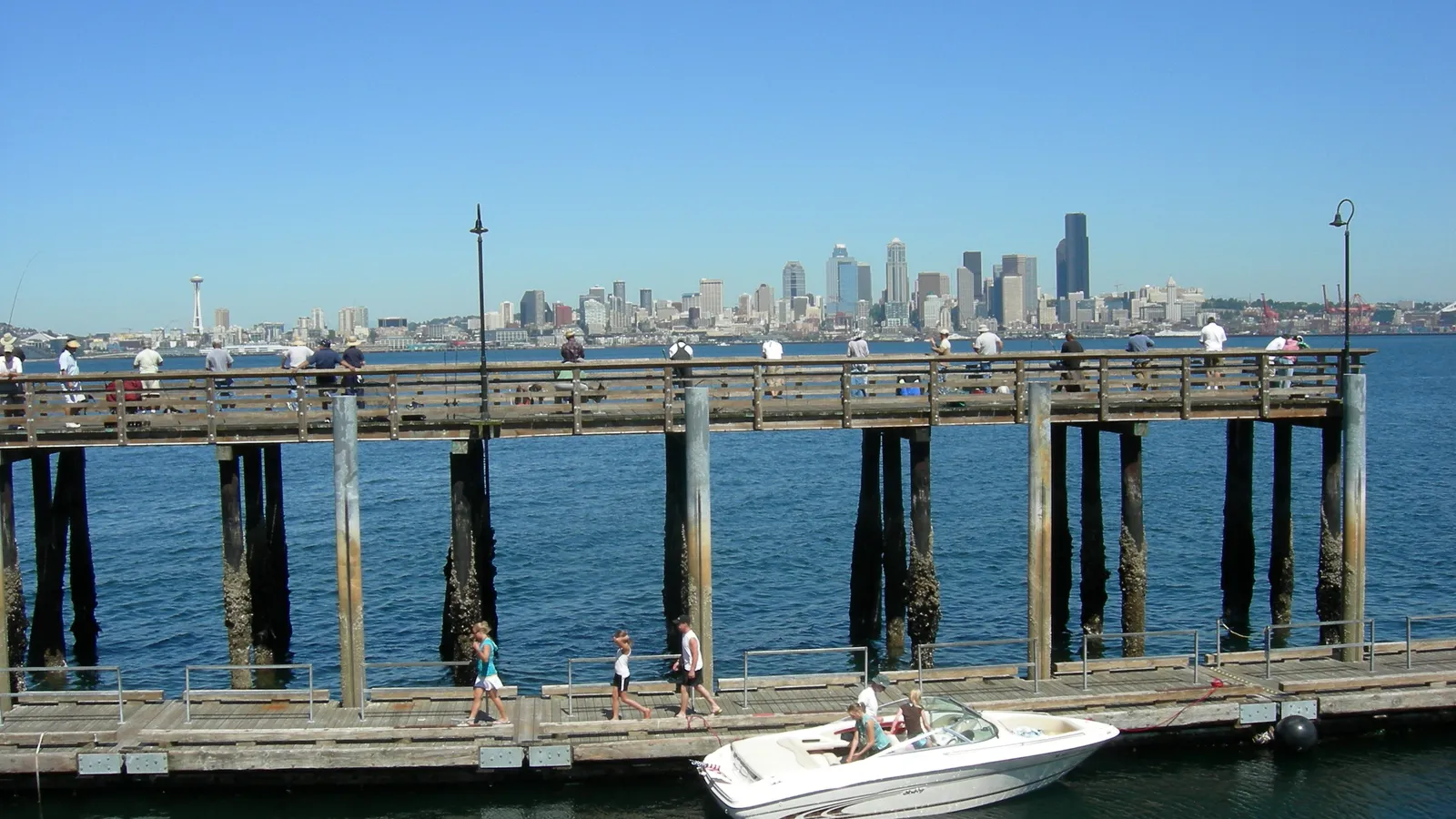 The fishing pier at Seacrest Park looking across Elliott Bay to downtown Seattle