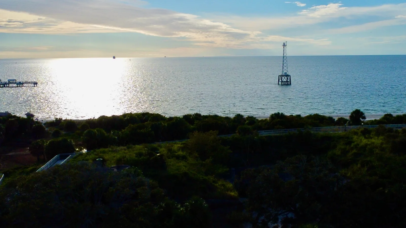 Sunset over the water from Fort De Soto Park, with a pier in the distance