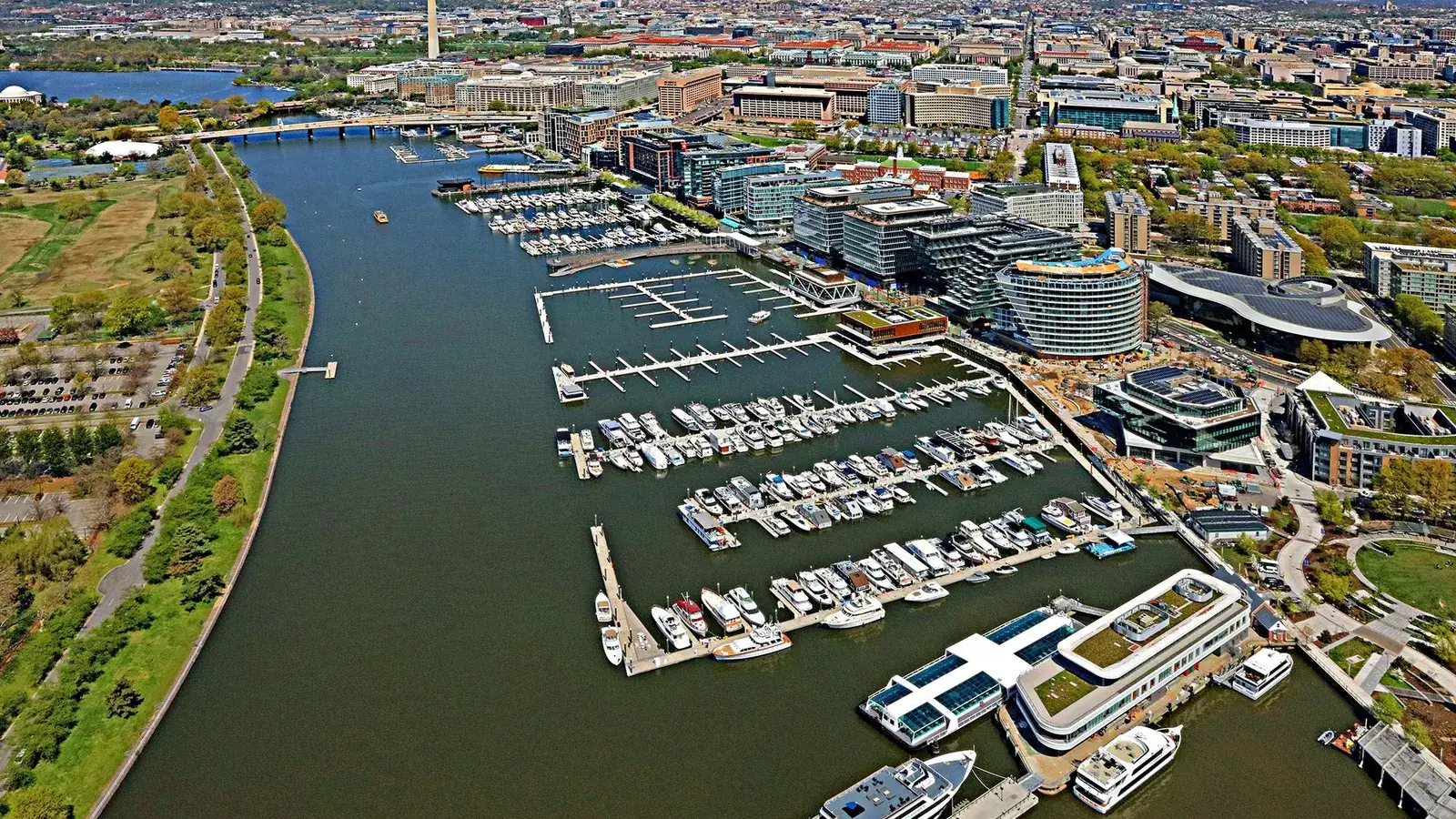 Aerial view of the Washington Channel with the Wharf's marinas on one side and East Potomac Park on the other